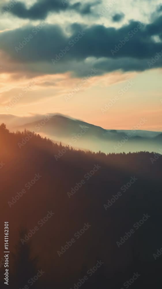 Vertical Screen Video. Epic foggy colorful sunrise in alp mountains. Dramatic clouds flow in bright sky, sun glow rising over mountain peak with golden light. Beautiful morning nature summer landscape Vertical Screen Video. Epic foggy colorful sunrise in alp mountains. Dramatic clouds flow in bright sky, sun glow rising over mountain peak with golden light. Beautiful morning nature summer landscape