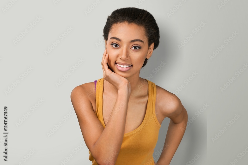 Portrait of young happy woman posing at background.