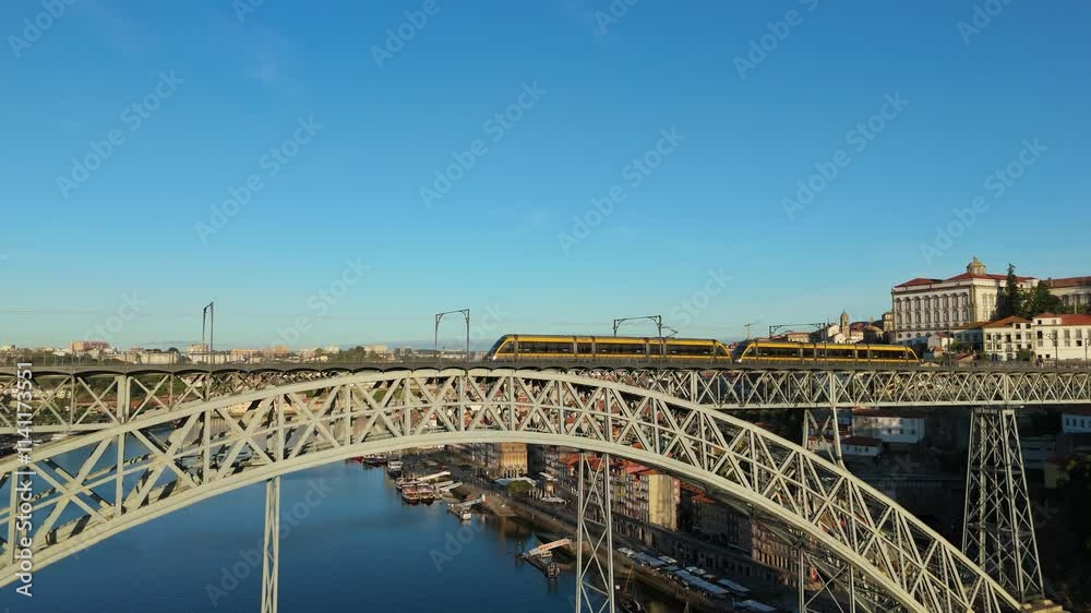 Porto City, Douro River and Dom Luis Bridge I with Tram in Morning. Aerial View. Portugal. Moving Forward and Upwards, Tilt Down Porto City, Douro River and Dom Luis Bridge I with Tram in Morning. Aerial View. Portugal. Moving Forward and Upwards, Tilt Down