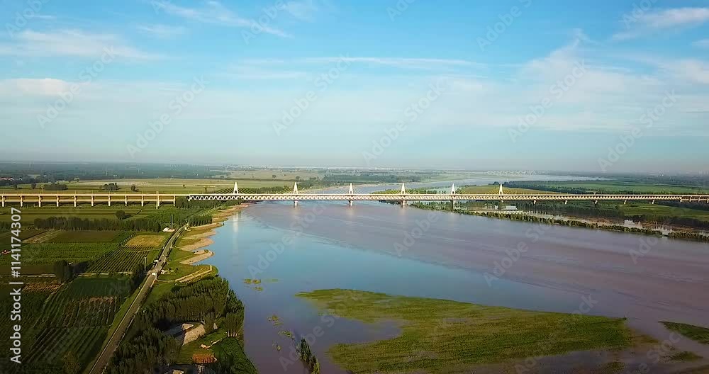 Stunning aerial views of the Yellow River dual purpose bridge showcasing its architectural beauty and surrounding landscape Stunning aerial views of the Yellow River dual purpose bridge showcasing its architectural beauty and surrounding landscape