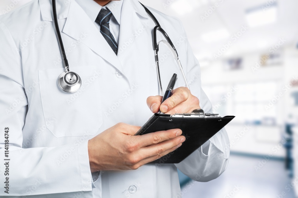 Hands of medical doctor hold clipboard writing notes Hands of medical doctor hold clipboard writing notes