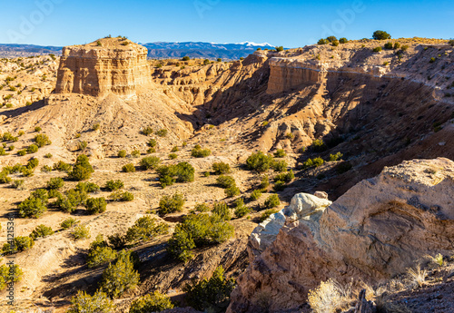 Sandstone Formation and Canyon in Desert Landscape at The Nambe Badlands, Nambe, New Mexico, USA photo