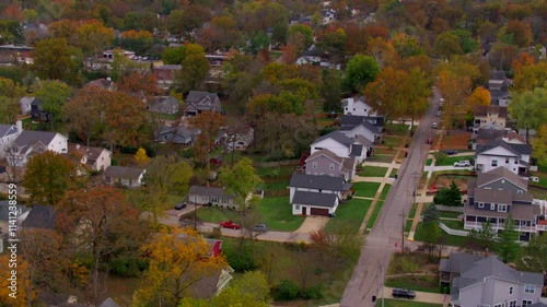 Aerial flyover residential neighborhood in Kirkwood area of St. Louis, Missouri on a cloudy day in Autumn. photo