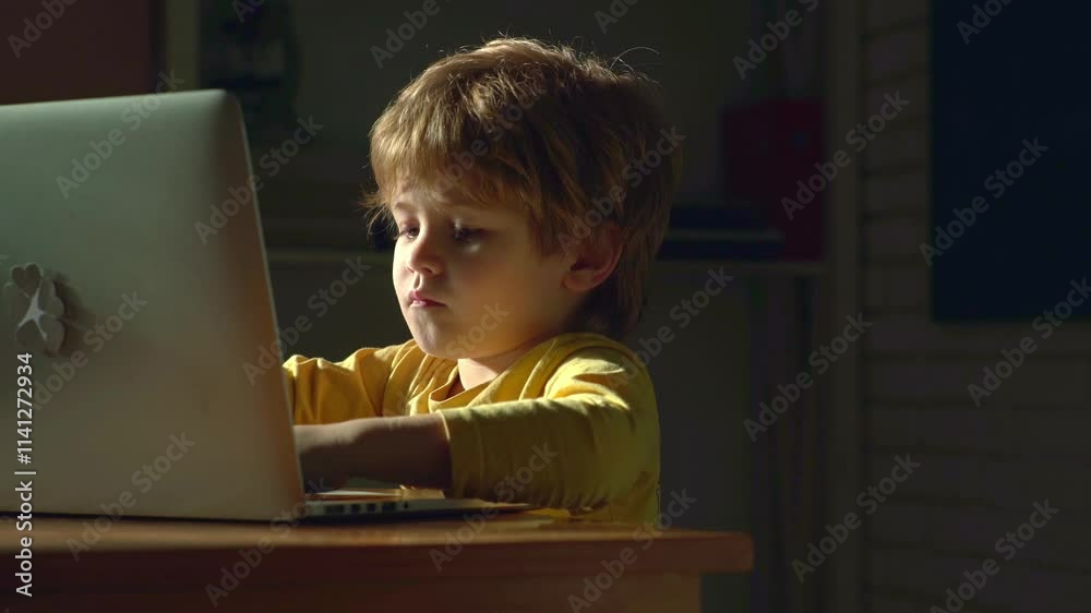 Baby with laptop. Blond baby working with laptop at home. Smart little ...