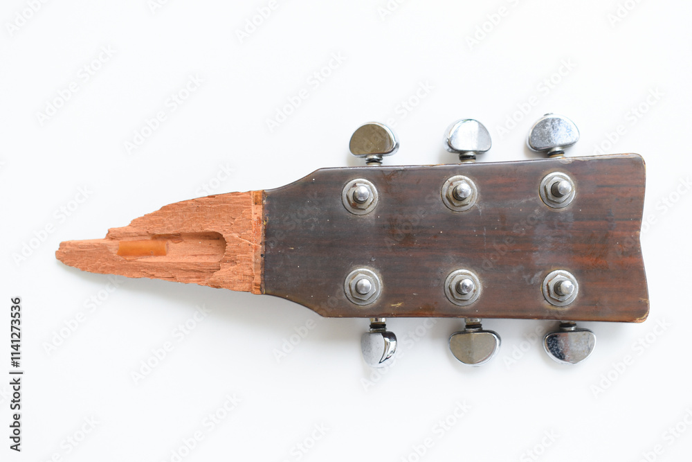 part of broken wood acoustic guitar isolated on white background