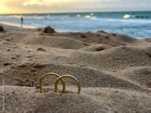 wedding rings on the beach photo