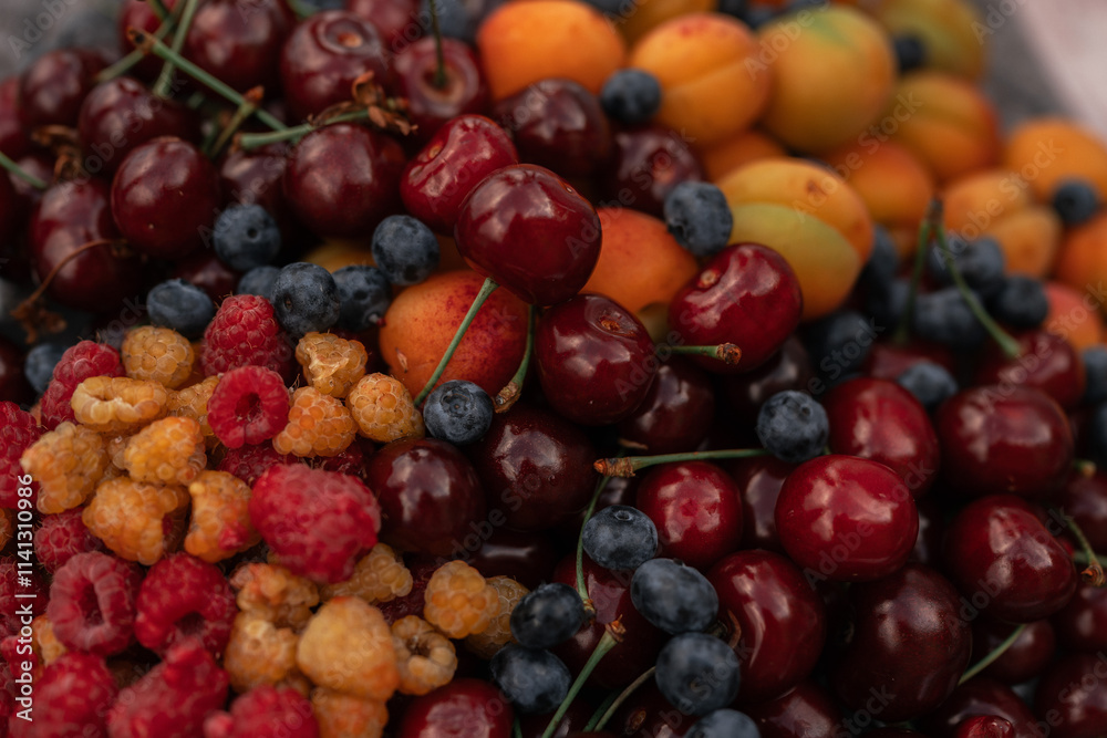 A close-up view of a variety of fresh berries, including blueberries, raspberries, blackberries A close-up view of a variety of fresh berries, including blueberries, raspberries, blackberries