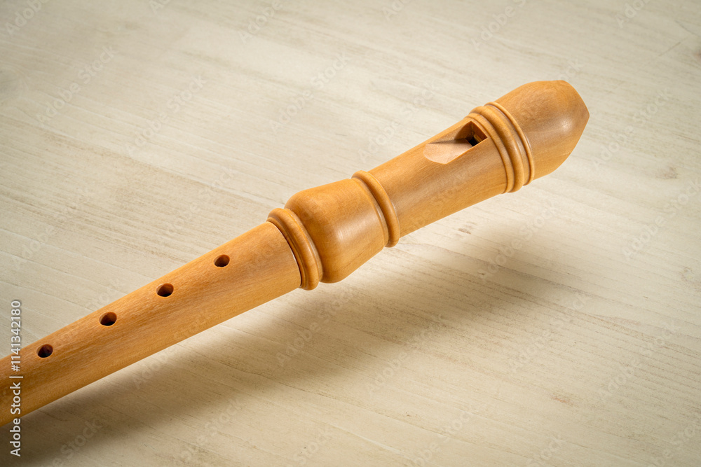 Naklejka premium wooden recorder flute instrument, classic German style, against wood