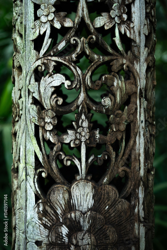 A plank of old carved wood.Pattern of flower carved on wood background. photo