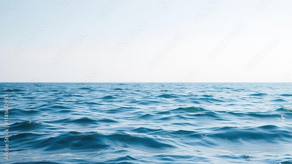 Obraz premium Tranquil ocean waves rippling under clear sky, peaceful water surface, ocean, clear sky, peaceful