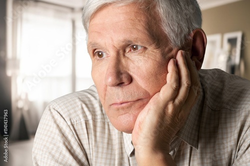 Elderly old sad man thinking of memory