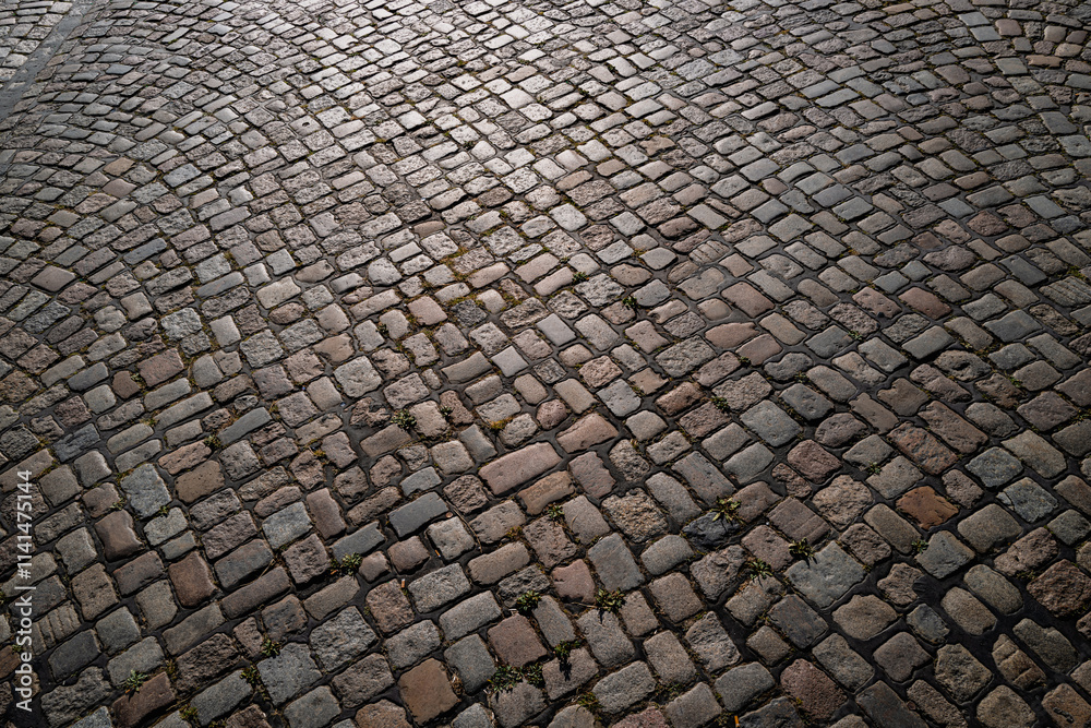 Pavement road. Background of bricks road. Stone cladding pavement. Brick surface background. Rough brick road. Cobblestone pavement background. Textured background. Sidewalk. Old cobblestone road. Pavement road. Background of bricks road. Stone cladding pavement. Brick surface background. Rough brick road. Cobblestone pavement background. Textured background. Sidewalk. Old cobblestone road.