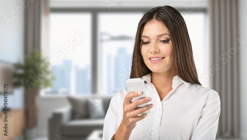 A young woman hold her mobile phone at home