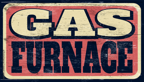 Aged and worn gas furnace sign on wood