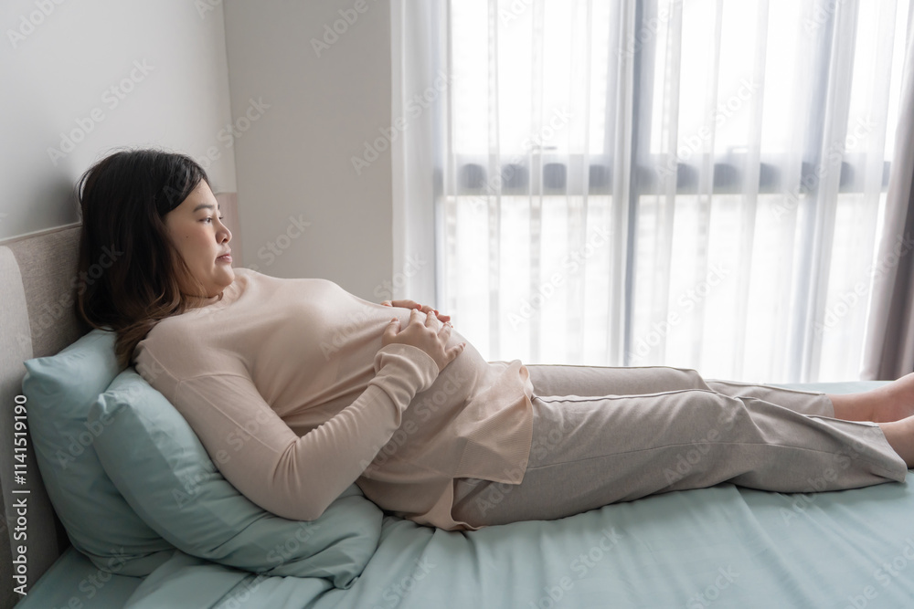 Pregnant asian woman holds hands on belly touching her baby caring about her health Beautiful happy pregnant woman tender mood photo of pregnancy Pregnant asian woman holds hands on belly touching her baby caring about her health Beautiful happy pregnant woman tender mood photo of pregnancy