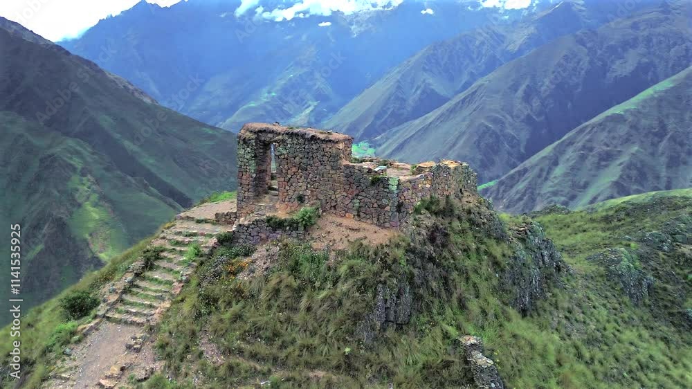 Home ruins at peak, aerial orbit dramatic views of Sacred Valley Ollantaytambo terraces, rich in Inca history and scenic Andes peaks Home ruins at peak, aerial orbit dramatic views of Sacred Valley Ollantaytambo terraces, rich in Inca history and scenic Andes peaks