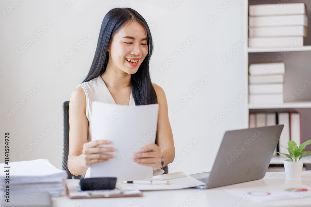 Young business asian woman working at office with documents on desk, doing planning analyzing the financial report, business plan investment, finance analysis concept Young business asian woman working at office with documents on desk, doing planning analyzing the financial report, business plan investment, finance analysis concept
