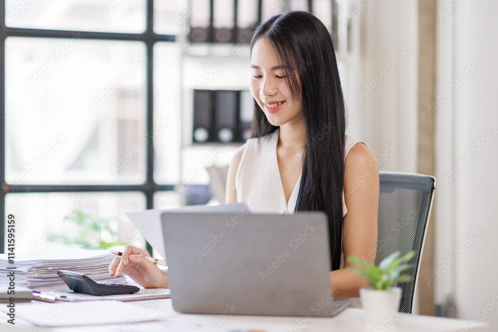 Young business asian woman working at office with documents on desk, doing planning analyzing the financial report, business plan investment, finance analysis concept Young business asian woman working at office with documents on desk, doing planning analyzing the financial report, business plan investment, finance analysis concept