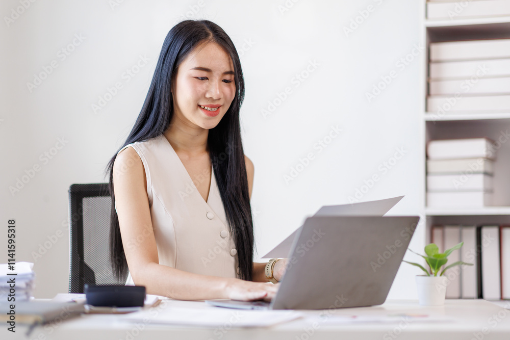 Young business asian woman working at office with documents on desk, doing planning analyzing the financial report, business plan investment, finance analysis concept Young business asian woman working at office with documents on desk, doing planning analyzing the financial report, business plan investment, finance analysis concept