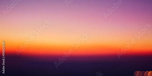 Colorful sky at sunset with orange, red, and yellow hues over a serene landscape, featuring clouds, sunlight, and a beautiful horizon