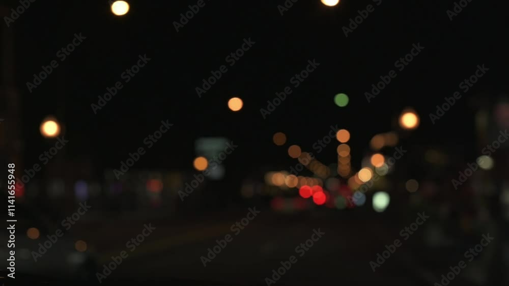 Defocused view of vibrant city lights glowing in night. serene urban atmosphere with colorful bokeh shapes and dark background. Blurred city lights at night. city lights glowing in night Defocused view of vibrant city lights glowing in night. serene urban atmosphere with colorful bokeh shapes and dark background. Blurred city lights at night. city lights glowing in night