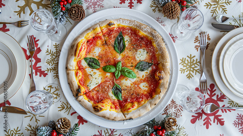 A white plate holding a delicious Margherita pizza, its vibrant red tomato sauce and green basil leaves contrasting beautifully against the snowy tablecloth decorated with snowflake patterns.