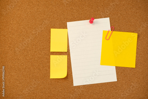 Blank sticky note paper on cork board wall. Noticeboard to organize life and work concept