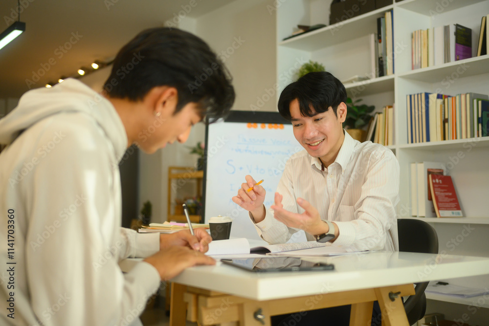 Tutor and student sharing ideas and discussing study materials during a home tutoring session Tutor and student sharing ideas and discussing study materials during a home tutoring session