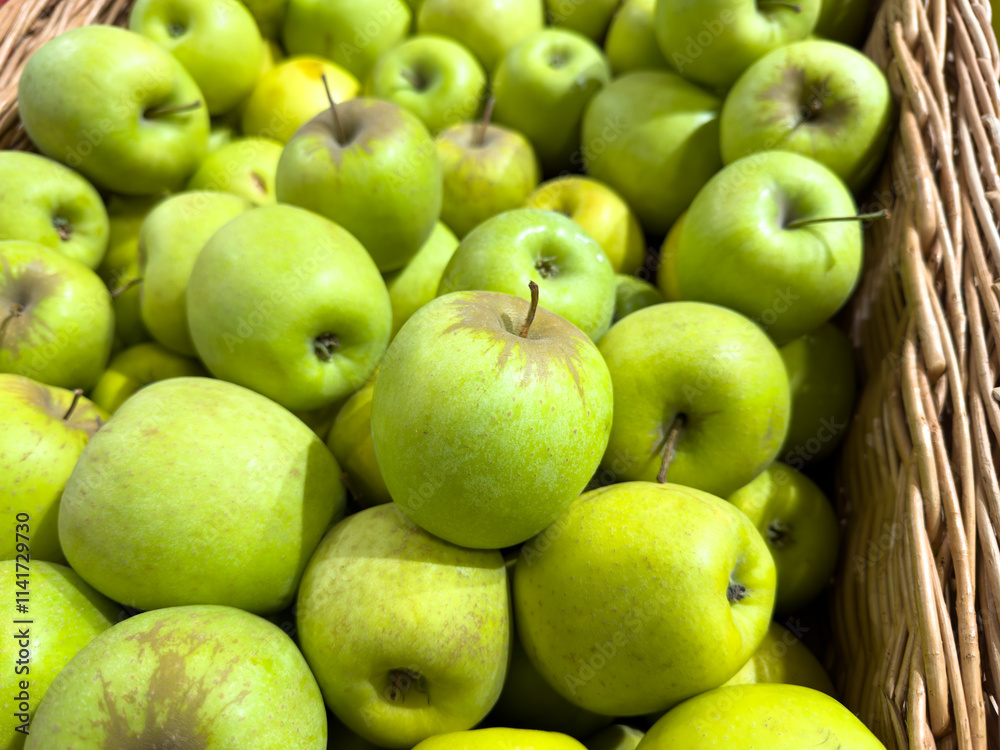 A basket full of green apples A basket full of green apples