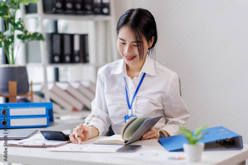 Asian woman hand using calculator to calculate doing finance, budgeting and tax calculation. finance, accounting with laptop computer on table, budget management, monthly expenses
Asian woman hand using calculator to calculate doing finance, budgeting and tax calculation. finance, accounting with laptop computer on table, budget management, monthly expenses