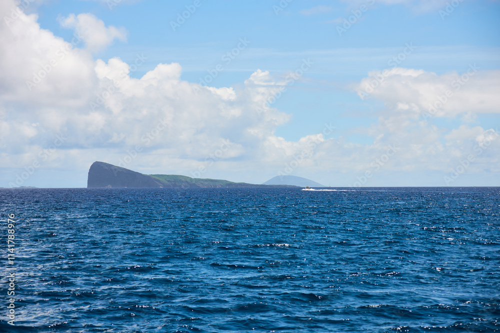 Coin de Mire (Gunner's Quoin), a protected Mauritian island 8 km off Mauritius' northern coast, is known for its steep profile and birdlife but is not open to visitors.