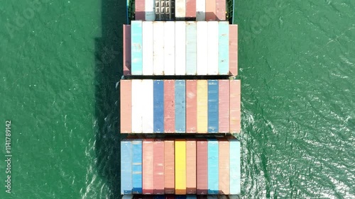 Large container ship at sea. Top down view. Aerial top view of cargo container ship vessel import export container sailing.