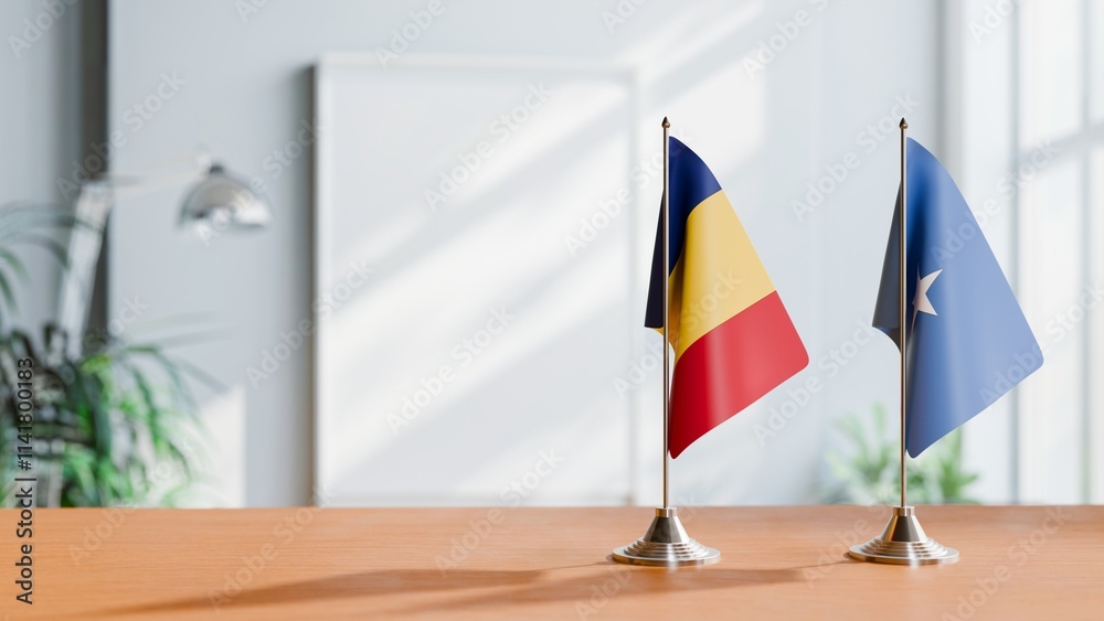 FLAGS OF ROMANIA AND SOMALIA ON TABLE FLAGS OF ROMANIA AND SOMALIA ON TABLE