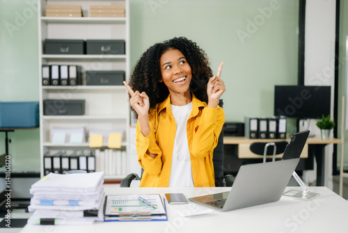 Young businesswoman working with working notepad, tablet and laptop documents talking on the smartphone, tablet photo