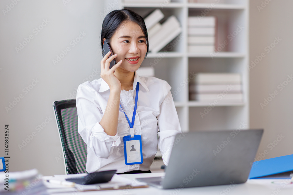 Asian woman entrepreneur busy with her work in the office. Young Asian woman work on desk laptop phone while planning sales, research or financial strategy in company
Asian woman entrepreneur busy with her work in the office. Young Asian woman work on desk laptop phone while planning sales, research or financial strategy in company