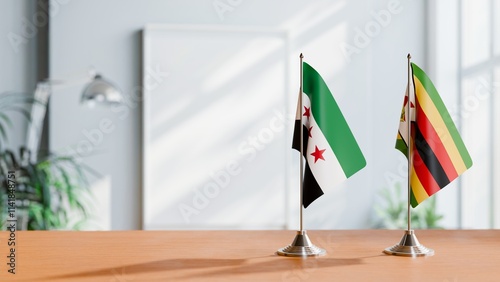 FLAGS OF SYRIA AND ZIMBABWE ON TABLE photo