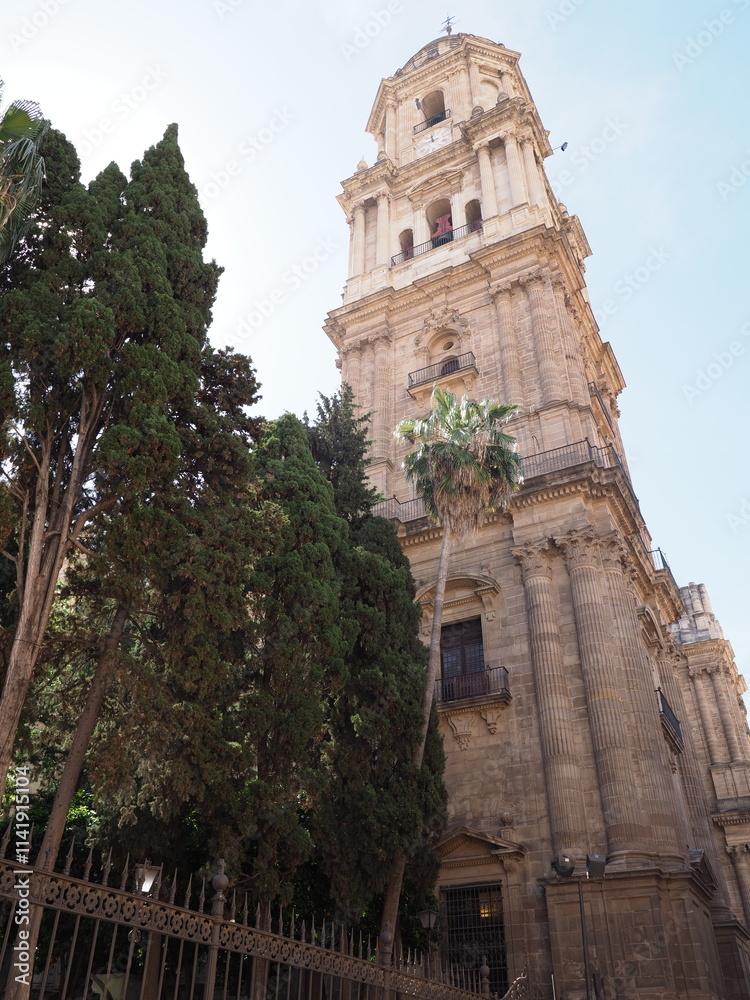 Fototapeta premium Scenic tower of cathedral in Malaga city in Spain - vertical