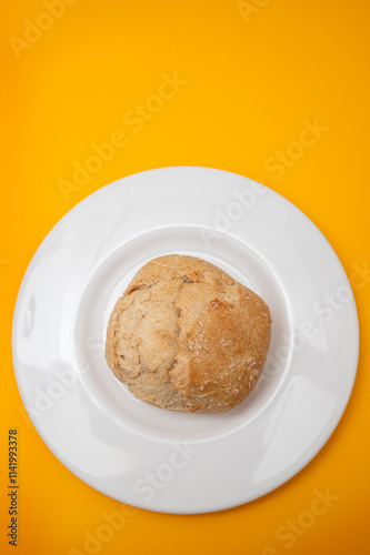 home made small bread with mix cereals on white plate