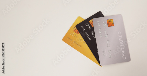 Three credit cards on white background.