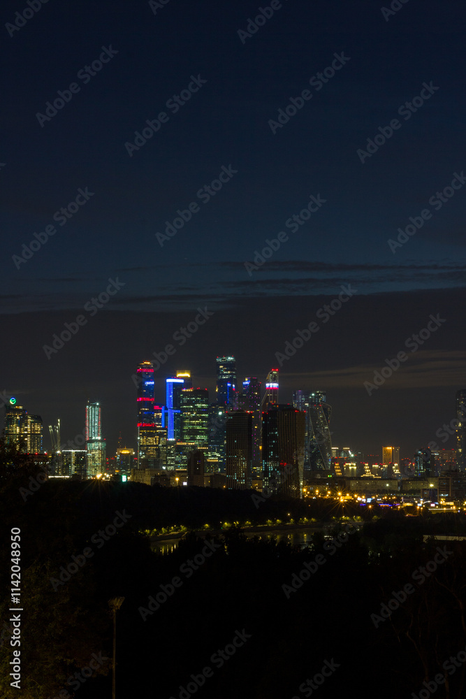 Fototapeta premium Long exposure photograph of Moscow cityscape. View from Vorobyovy Gory to skyscrapers of Moscow business district.