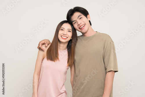 Happy asian couple attractive in various action gesture standing on isolated white background. Cheerful Smiling young man and woman photo