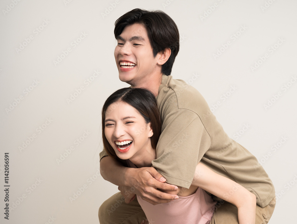 Piggyback ride Happy asian couple attractive in various action gesture standing on isolated white background. Cheerful Smiling young man and woman fun with piggyback ride Piggyback ride Happy asian couple attractive in various action gesture standing on isolated white background. Cheerful Smiling young man and woman fun with piggyback ride