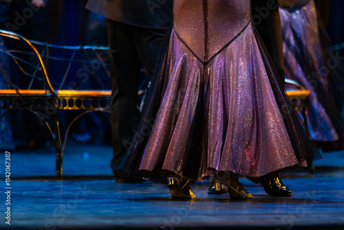 Closeup of legs dancing waltz on theatre stage