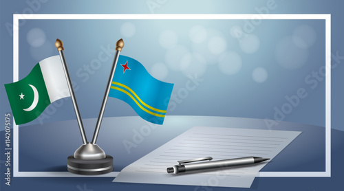 Pakistan and Aruba National flags on small table with bokeh background, cooperative relationship