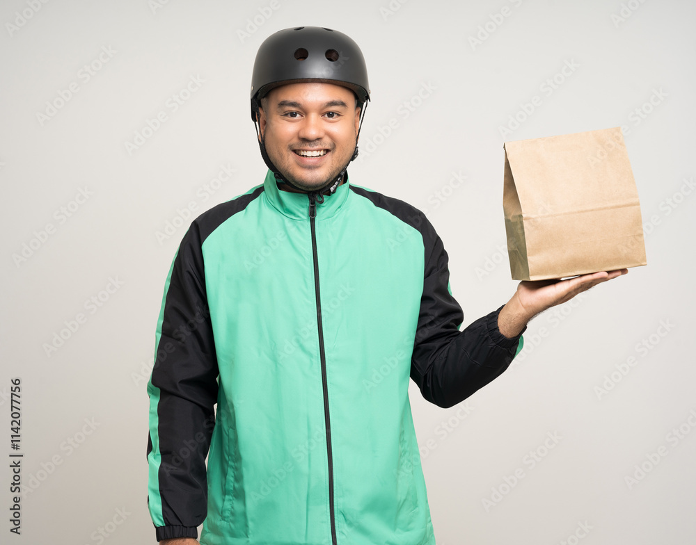 Young asian rider wearing green jacket uniform and bike helmet various action holding food paper bag delivery to customer. Male delivery service worker. Courier and shipping food service. Young asian rider wearing green jacket uniform and bike helmet various action holding food paper bag delivery to customer. Male delivery service worker. Courier and shipping food service.
