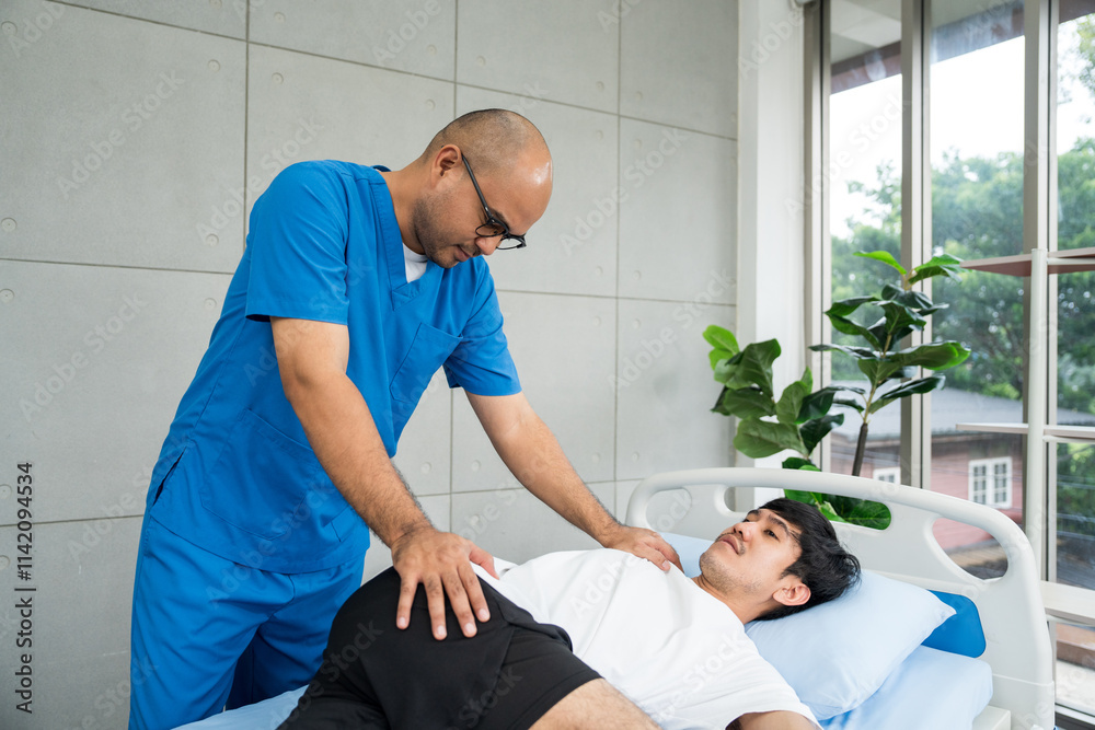 Obraz premium Physical therapy. Male Nurse aids young man in recovering from spine injury and providing orthopedic massage Orthopedic healthcare and chiropractor with person for physical therapy rehabilitation