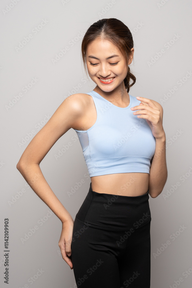 Young beautiful smiling asian woman with sportswear on isolated white background. Portrait happy healthy slim fit and firm attractive sporty woman standing pose exercise workout in studio. Young beautiful smiling asian woman with sportswear on isolated white background. Portrait happy healthy slim fit and firm attractive sporty woman standing pose exercise workout in studio.