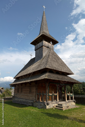 Romania wooden churches on a cloudy summer day