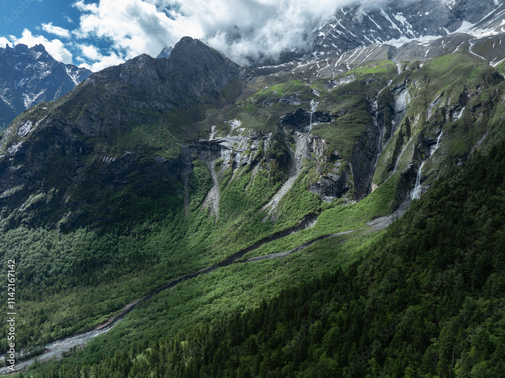 Aerial view of beautiful high altitude snow capped mountain and waterfall landscape Aerial view of beautiful high altitude snow capped mountain and waterfall landscape