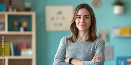 Female child psychologist standing warmly in a family clinic for stock photo